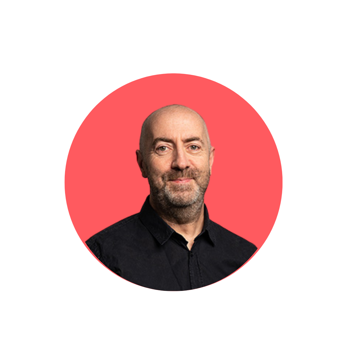 smiling bald man with a beard wearing a black t-shirt, the background is red